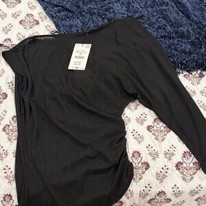 Zara’s asymmetrical sheer top